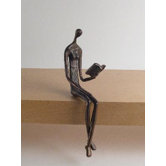 Woman Reading Over Ledge in Cast Bronze