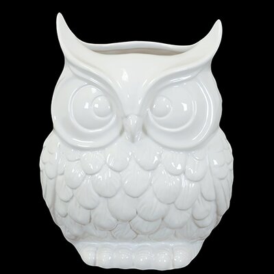 white ceramic owl figurine