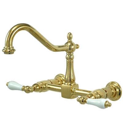 Elements of Design Heritage Two Handle Wall Mount Bridge Kitchen Faucet with Porcelain Lever Handles